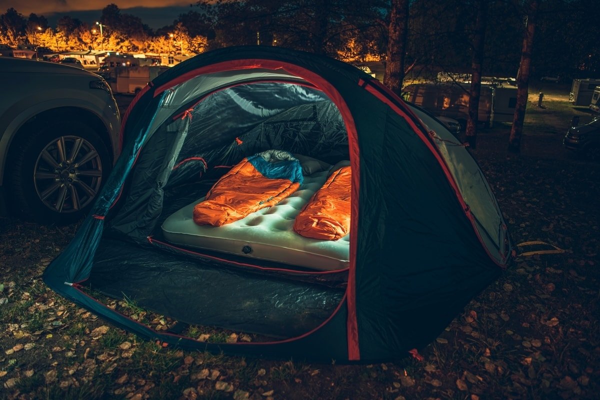 Sleeping bags in a tent at night