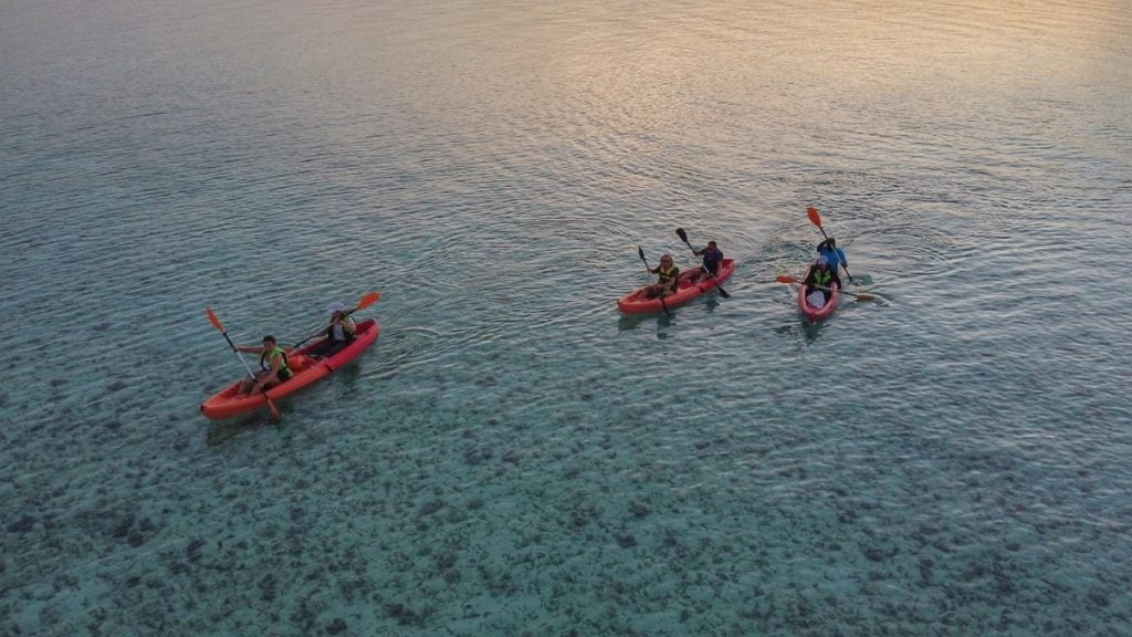 Group of people kayaking together