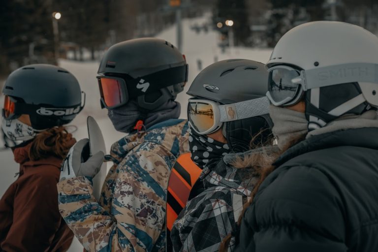 four-skiers-wearing-ski-helmets-and-goggles