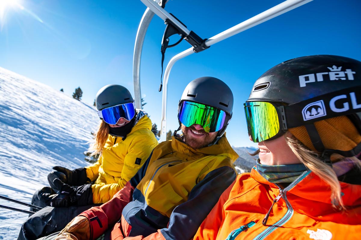 three skiers share a skilift