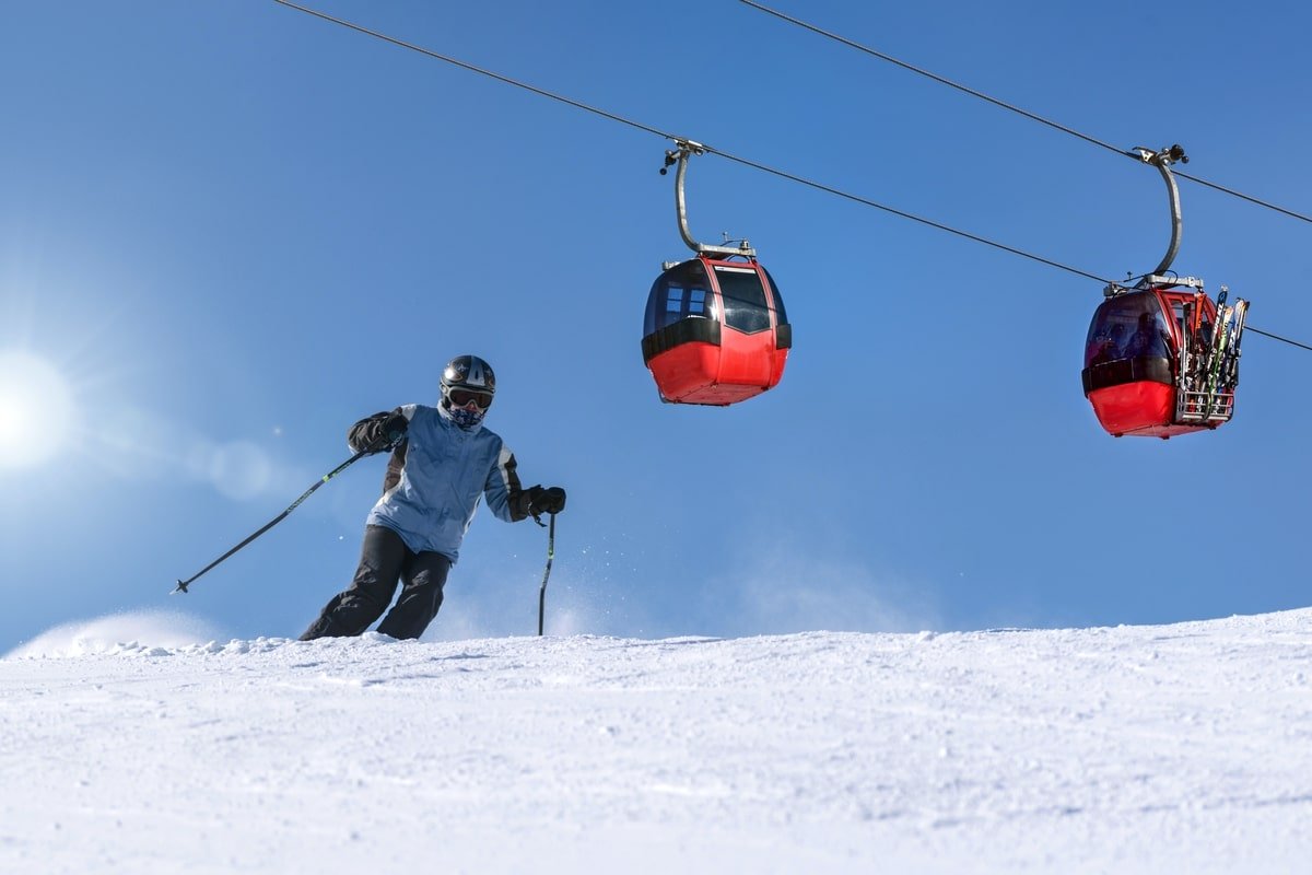 skier-with-ski-lift-in-background
