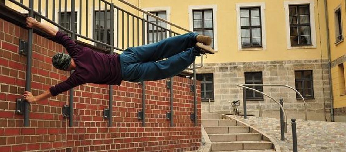 man-doing-parkour-in-pants